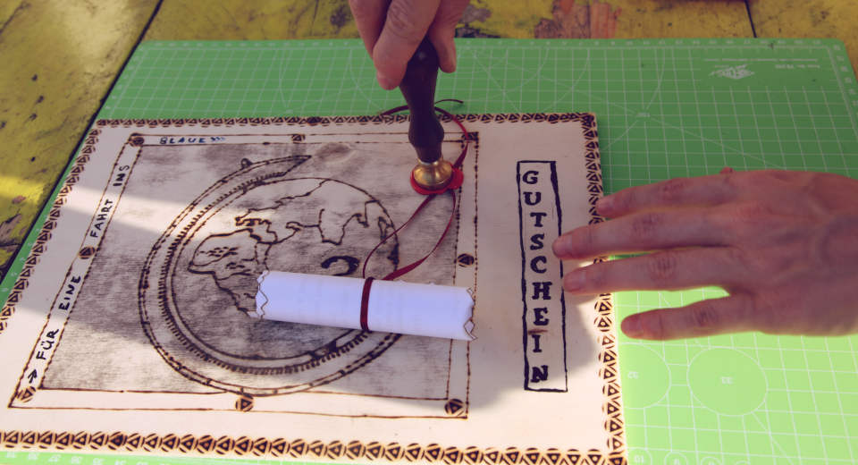 How To Make A Travel Voucher With The Branding Iron Tutorial The text for the travel voucher for an outing is decoratively attached to the wooden board with a seal and sealing wax